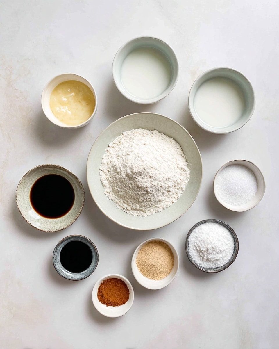 The image shows nine small white bowls arranged neatly on a white marbled surface. In the center, a large bowl holds a pile of white flour with a slight indentation in the middle. Around it, the other bowls each contain different ingredients: two medium bowls at the top with white liquids, one small bowl with a pale yellow paste to the left, a small bowl with a dark syrupy liquid below it, and a medium bowl with white granulated sugar on the right. Along the bottom, four very small bowls are lined up holding a light brown powder, fine white powder, cinnamon-colored powder, and another white powder. The bowls are spaced evenly, creating a clean, organized look. photo taken with an iphone --ar 4:5 --v 7